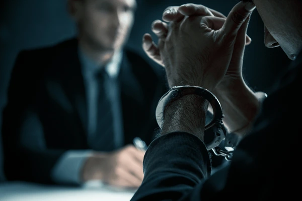 criminal-man-handcuffs-interrogation-room-600nw-1117417790 criminal-man-handcuffs-interrogation-room-600nw-1117417790